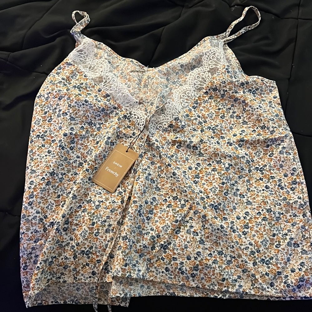 Never worn. Size large. The back is an open V with lace